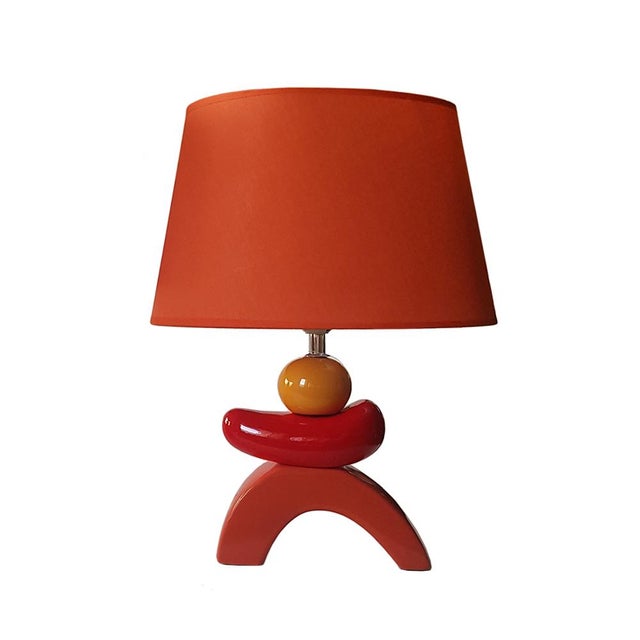 A pair of sculptural organic table lamps In the style of Francois Chatain "Pebble" lamps. The lamps are reminiscent of...