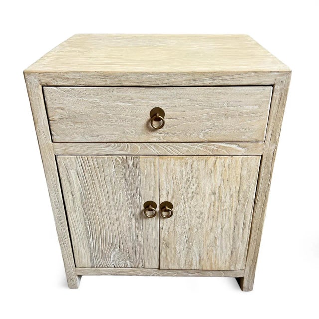 Simple raw bleached elm wood nightstand with one drawer and cabinet space below. Brass finish metal ring pulls. Modern...