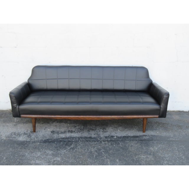 This beautiful Sofa is made out of wood, solid wood, and upholstery. The sofa has Mid Century Design, long silhouette,...