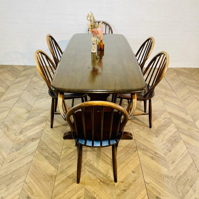 A Beautiful and Iconic, 1960s Ercol Refectory Table - Model Number 419 The table is from the company's popular Old...