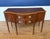 This is a 56 inch wide Hepplewhite Mahogany Sideboard by Leighton Hall. It features a classic serpentine shaped front,...