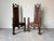 Magnificent pair of antique Spanish Gothic Revival-style throne chairs, finely hand-carved from solid wood. Each chair...