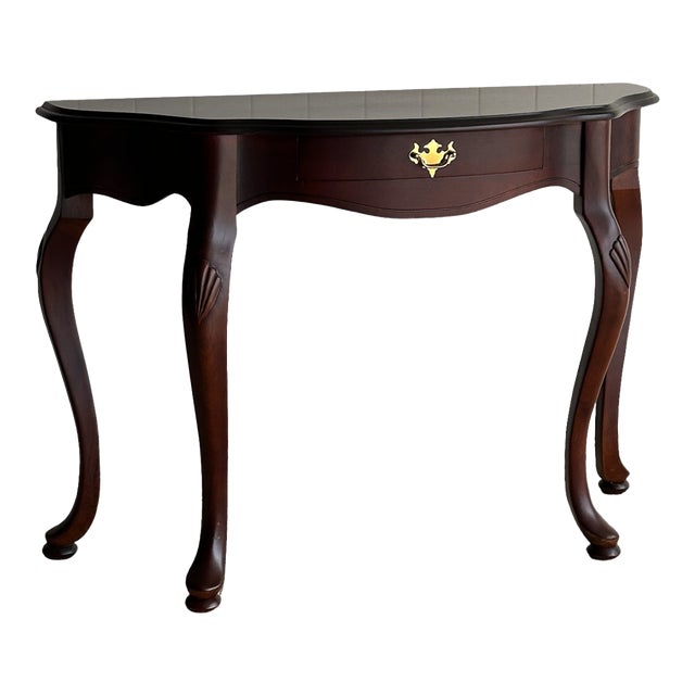 Vintage Mahogany Entry Console Table With Shaped Front and Brass Pull For Sale