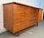 A classic mid-century modern lowboy dresser crafted from richly grained walnut by Young Manufacturing. Features clean...