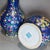 Gorgeous matching pair of scalloped Chinese famille rose porcelain vases with rich deep blue ground and fine gilt dividing...