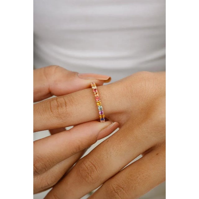 This is part of Chairish’s Fine Jewelry assortment. Stackable Multi Color Sapphire Eternity Band Ring in 14k gold...