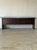 This long credenza features a streamlined profile with four deep pull-out drawers spanning its length. The horizontal form...