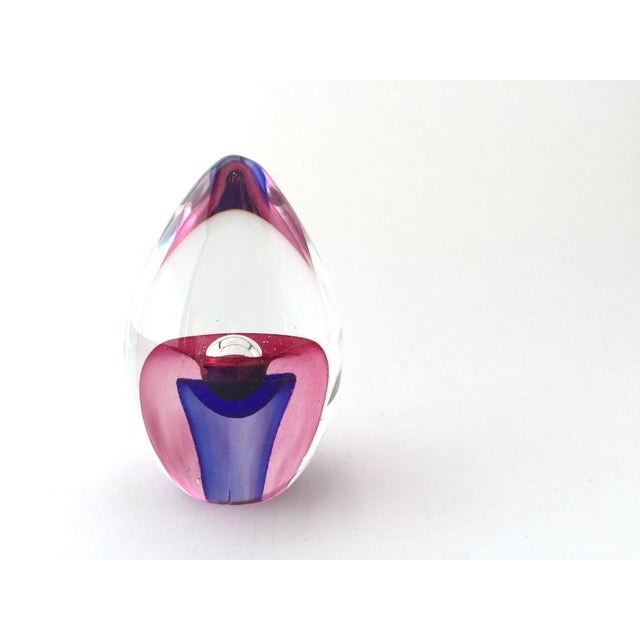 Here is a large vintage Murano style glass paperweight. This beautiful hand blown piece has a purple blossom nestled in a...