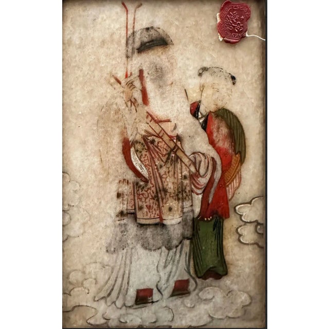 A painting on stone, this piece depicts two figures standing in the heavens, their feet amongst the clouds. On the...