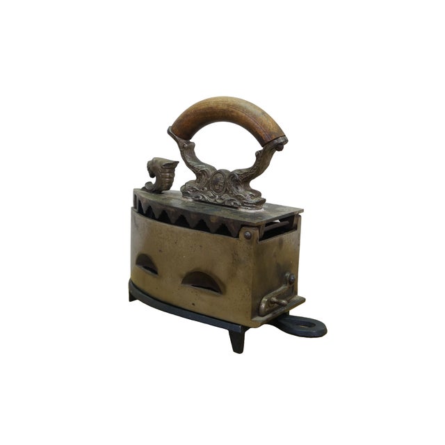 Antique charcoal-heated / coal / brazier clothes iron / sad iron / flat iron featuring a decorative animal / lion head and...