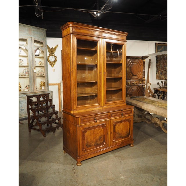 More information coming soon… A stunning walnut bookcase, hand-carved circa 1900s, in the style of Louis Philippe. The...