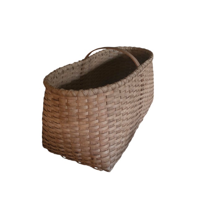 A wonderful, oversized oval splint wood gathering basket. Perfect accent piece. Can be used for many things.