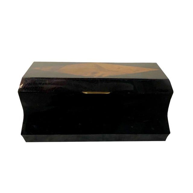 A vintage 1970s Maitland Smith crackled lacquer box with a burled walnut inlay and brass fittings. Box is a dark brown and...