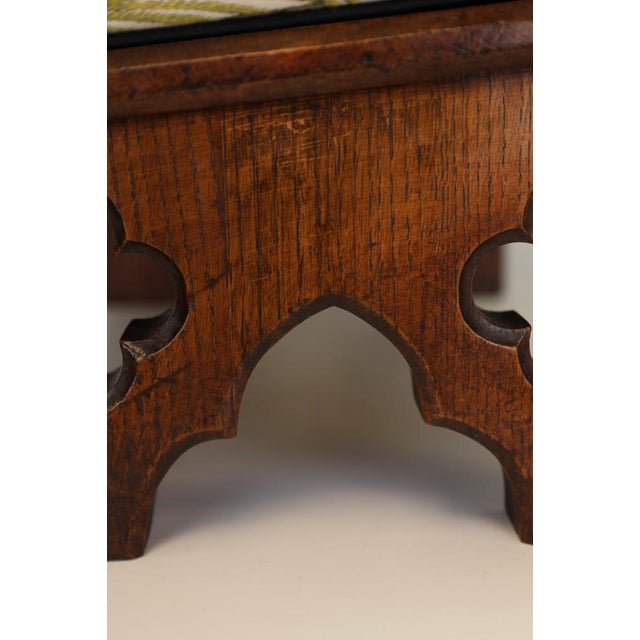 Pair of Victorian Gothic Revival Oak Footstools, Pugin Style, c.1860–1880 An exceptional and highly decorative pair of...