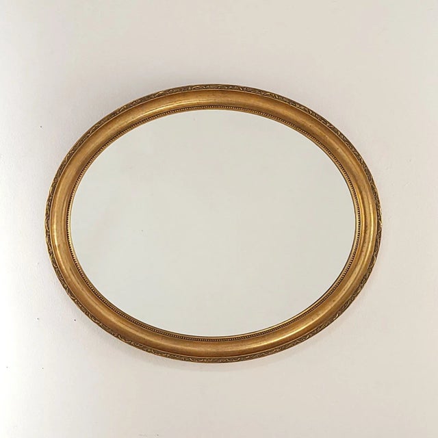 A vintage oval mirror, France circa 1950.