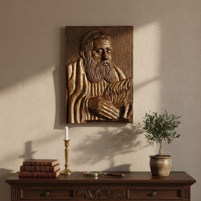 This original hand carved wood bas relief wall plaque depicts a scholarly rabbi deeply engaged in the study of the Torah,...