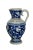 A lovely antique Simon Peter Gerz Stein / pitcher. Blue and white salt glaze with a monk at the center wrapped within...