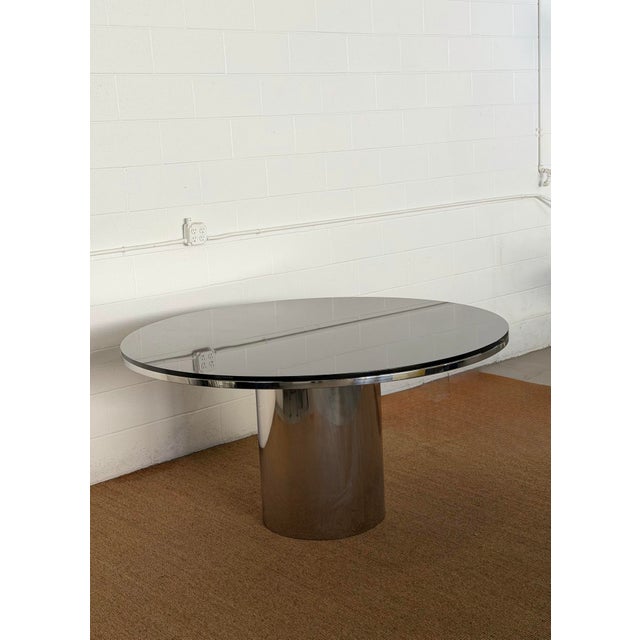 We are very pleased to offer this striking vintage “Anello” dining table by Brueton, attributed to Louis A. Lara, circa...