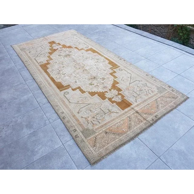 This is a vintage Turkish Anatolian kilim rug from the 1960s. The piece was hand-woven.