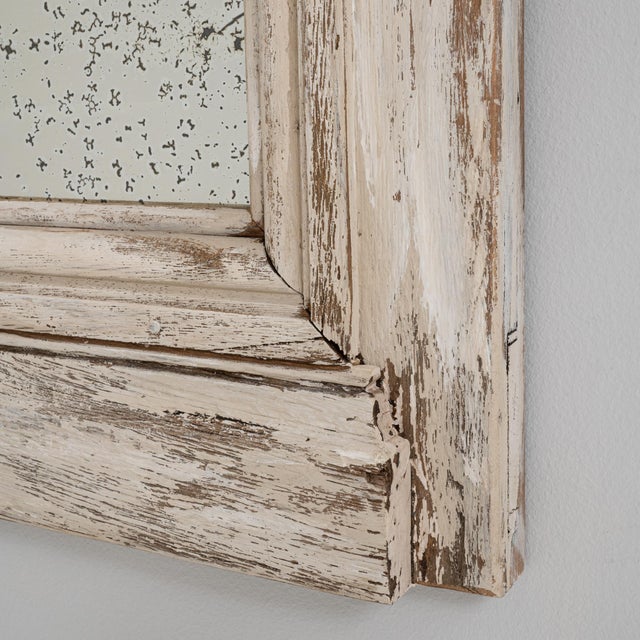 This pair of 19th Century French mirrors features boldly architectural wooden frames with a white patinated finish,...