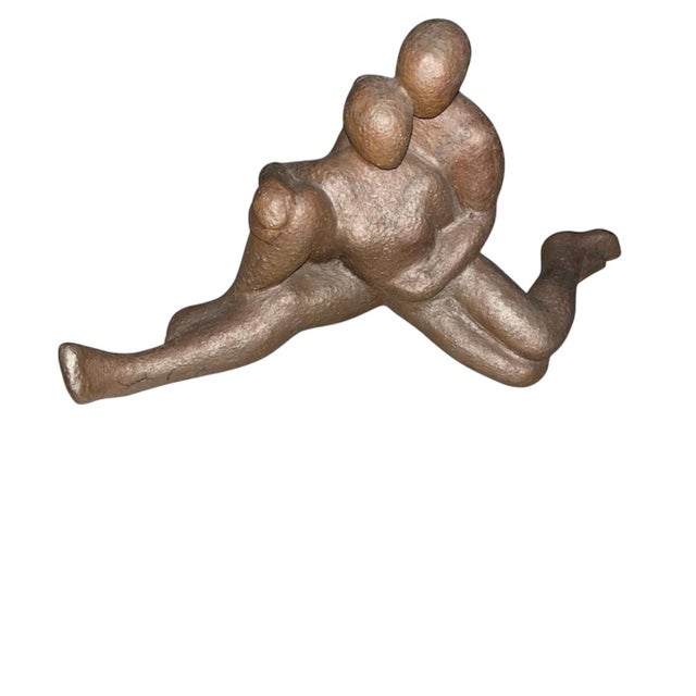 MCM faceless, featureless lounging couple focal piece. It is a hollow statute and does have some sort of marking on...
