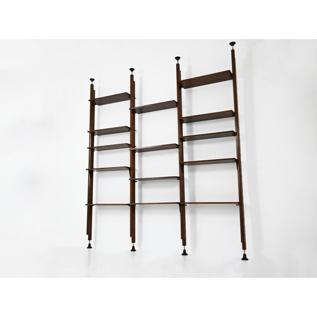 Modular bookcase with 14 shelves. Adjustable height: minimum height: 261 cm, maximum height: 418 cm. Wear consistent with...