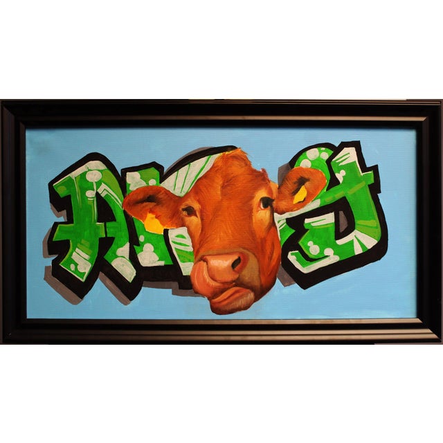 This artwork features a striking depiction of a cow's head, rendered with rich, warm tones that contrast against a vibrant...