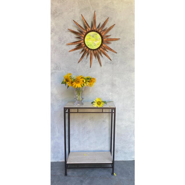 This Spanish sunburst mirror, dating back to the 1950s, is a remarkable piece with a copper plated metal frame designed to...