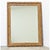 A hand-carved and painted picture frame from 18th century France that has been meticulously restored; it now houses a new...