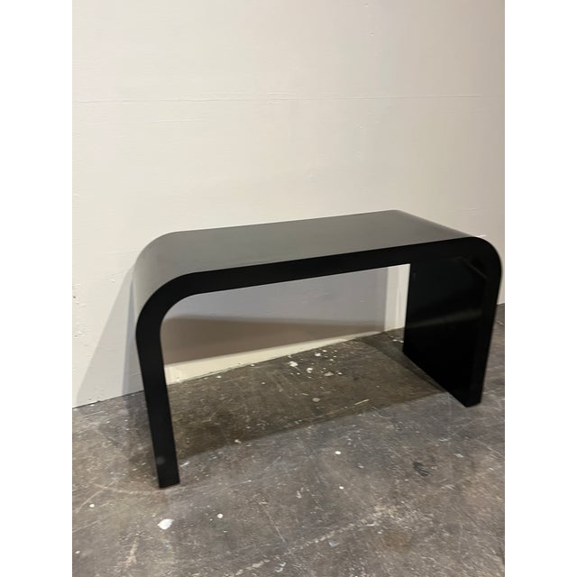 Mid Century Black Laminate Waterfall Console. Light scratches from normal use. 48w x 17.75d x 27.5h SKU 6-1044 DF