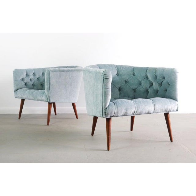 The seats are newly upholstered in Gentle Current by Calico, a stunning microsuede. The seat has a tufted detail.