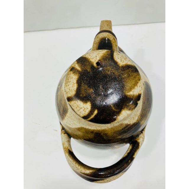 This mid century style teapot was hand crafted in New England The two part glaze feature a soft mellow low luster tan...
