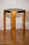 The unusual, iconic fan leg stool 'X600' by Alvar Aalto has a black lacquered seat and is stamped on the underside. It...