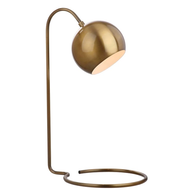 This contemporary table lamp brings a playful retro vibe to any living room. it's brass and gold finish elevates it's mid-...