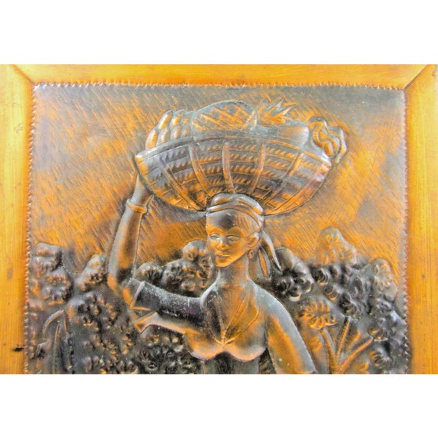 The product is a large, original wall sculpture of a woman with a basket, created by artist R. Mungal Trinidad. Made of...