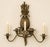 A dramatic vintage four-light wall sconce crafted of heavy iron, featuring a large dimensional pineapple—the traditional...