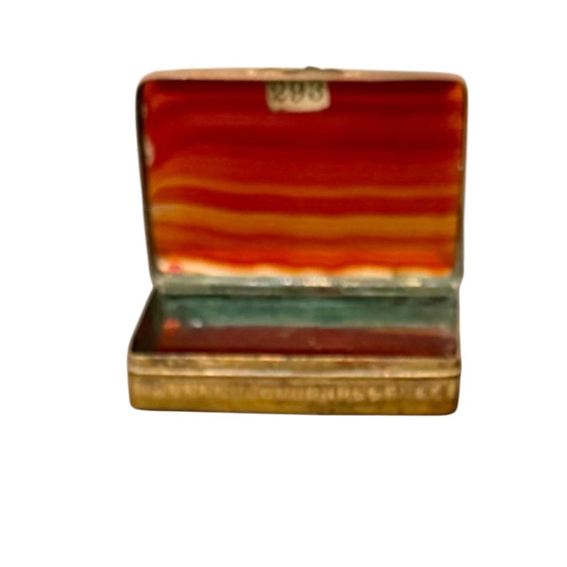 A refined 19th century agate snuff box from an important private collection. This elegant example is beautifully...