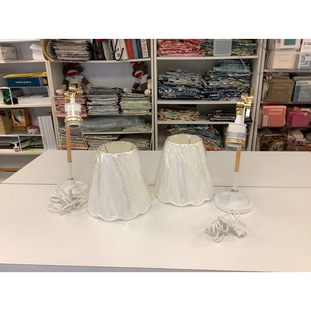 New out of the box - 2 Larkspur wall sconces from Serena and Lily. Made of brass and powdercoated white with rattan...