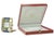 A beautiful cartier alarm clock in a gilded folding case with a signed cartier quartz movement and distinctive sapphire...