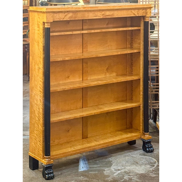 A pair of fine English open bookcases (or sets of shelves) in the Biedermeier style - each cabinet featuring a moulded...