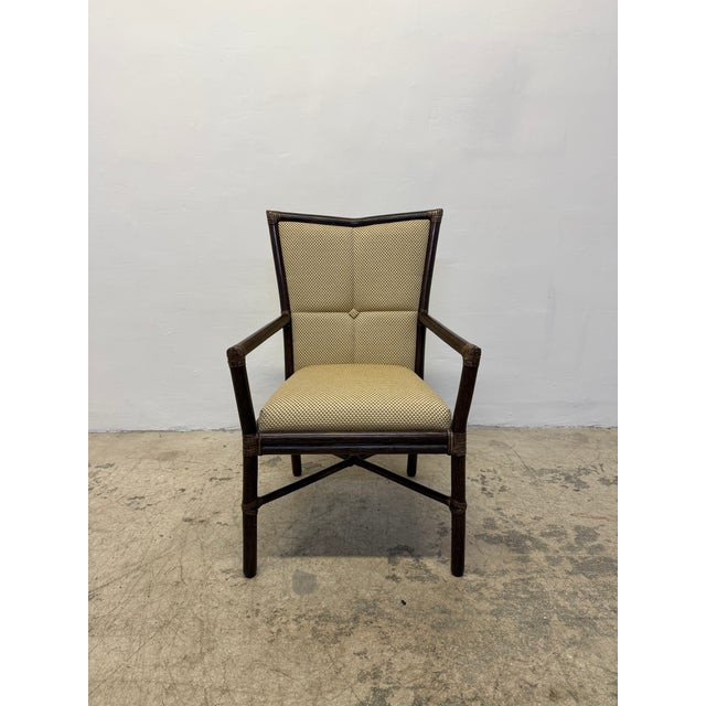 Vintage upholstered arm chair with leather wrapped bamboo frame by McGuire, 1970s.