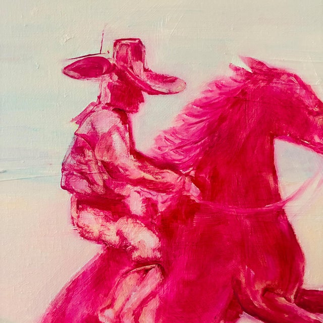 wide-brimmed hat rides a rearing horse, both rendered in hot pink against a dreamy pastel background of aqua, cream and...