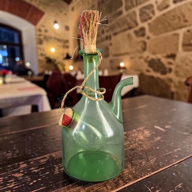 This Vintage Hand Blown Italian Green Glass Wine Decanter is a unique and handmade piece perfect for adding a touch of...
