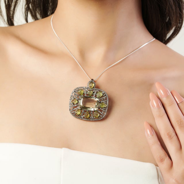 This exquisite 925 sterling silver pendant showcases a refined, vintage-inspired design centered around a luminous...