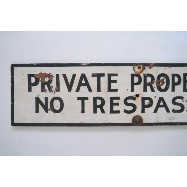 Circa 1940s one sided hand lettered black and white wood Private Property No Trespassing Sign. Sign has discolorations,...