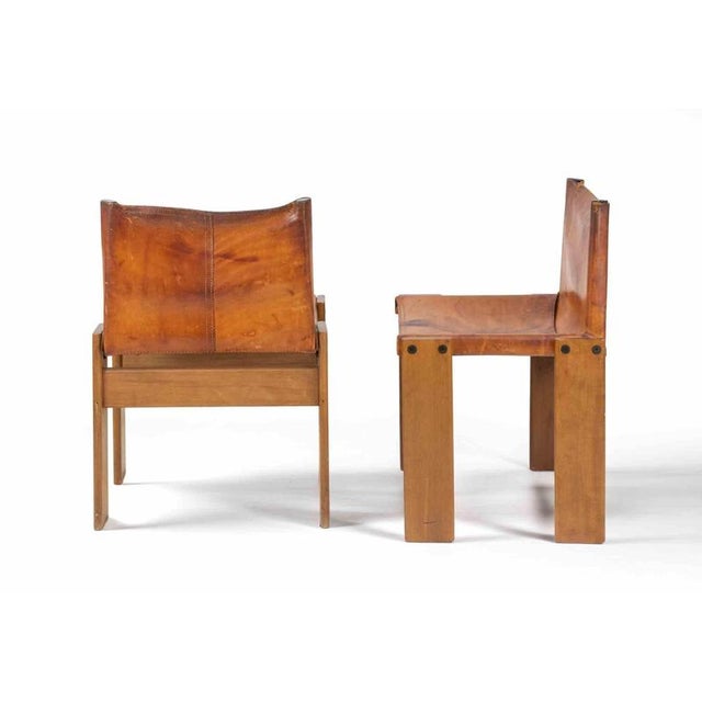 Realized in 1974 by Afra and Tobia Scarpa, this iconic set of 6 chairs features a bold architectural structure in solid...