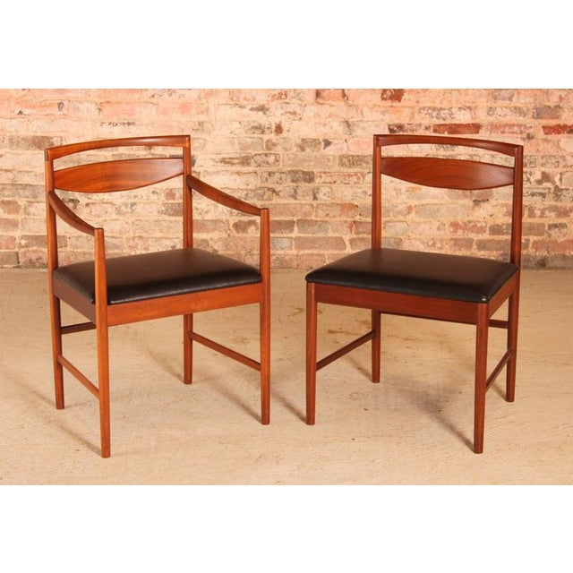 Set of 6 mid century teak dining chairs by mcintosh, circa 1960s. One carver and 5 side chairs. Newly reupholstered with...