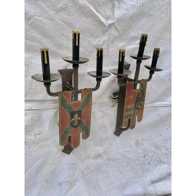This pair of Late 19th Century Sconces were crafted in England in the 1800's. Each hand forged iron sconce is shaped as a...