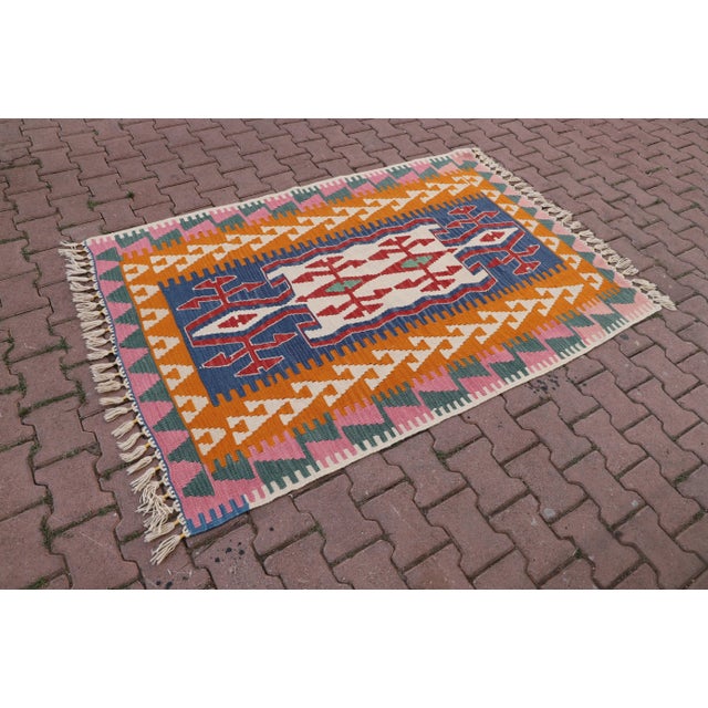1960s Tribal Orange Hand Knotted Kilim Rug Size: 4.3 x 6.2 ft (130 X 188 cm) 51 x 74 inches Color: Orange, Pink, Green,...