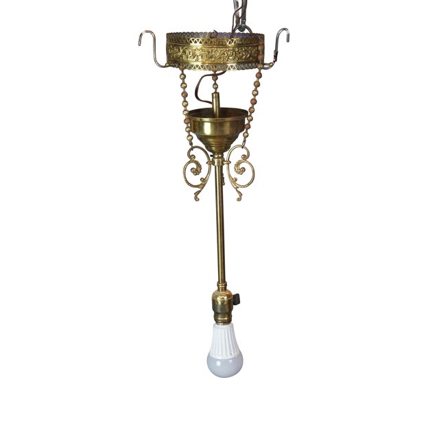 Antique Victorian drop pendant light . Made of brass featuring a Neoclassical scrolled and pierced filigree acanthus...